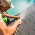 gentleman cleaning pool deck
