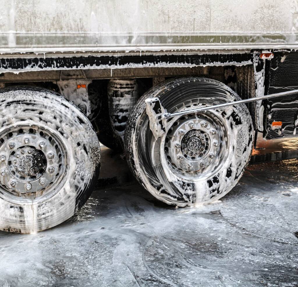 close-up of tires being washed and covered in soap
