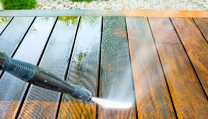 spraying grime off wooden deck