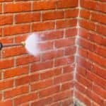 spraying brick siding