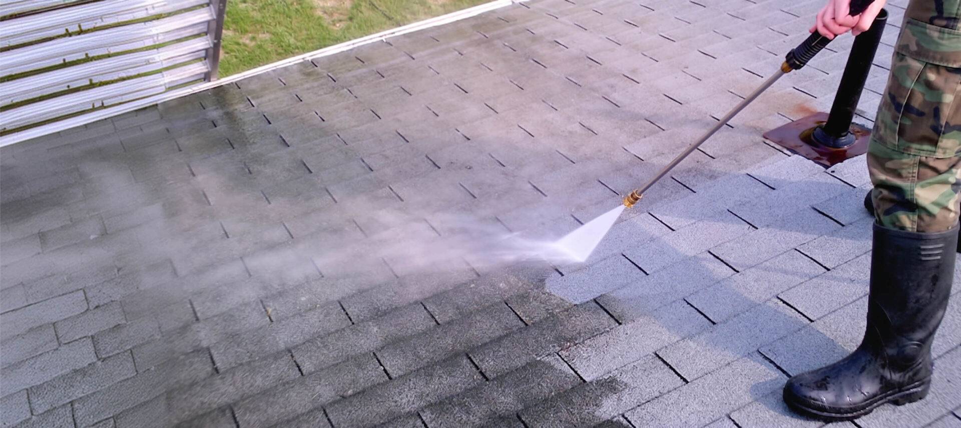 gentleman power washing roof