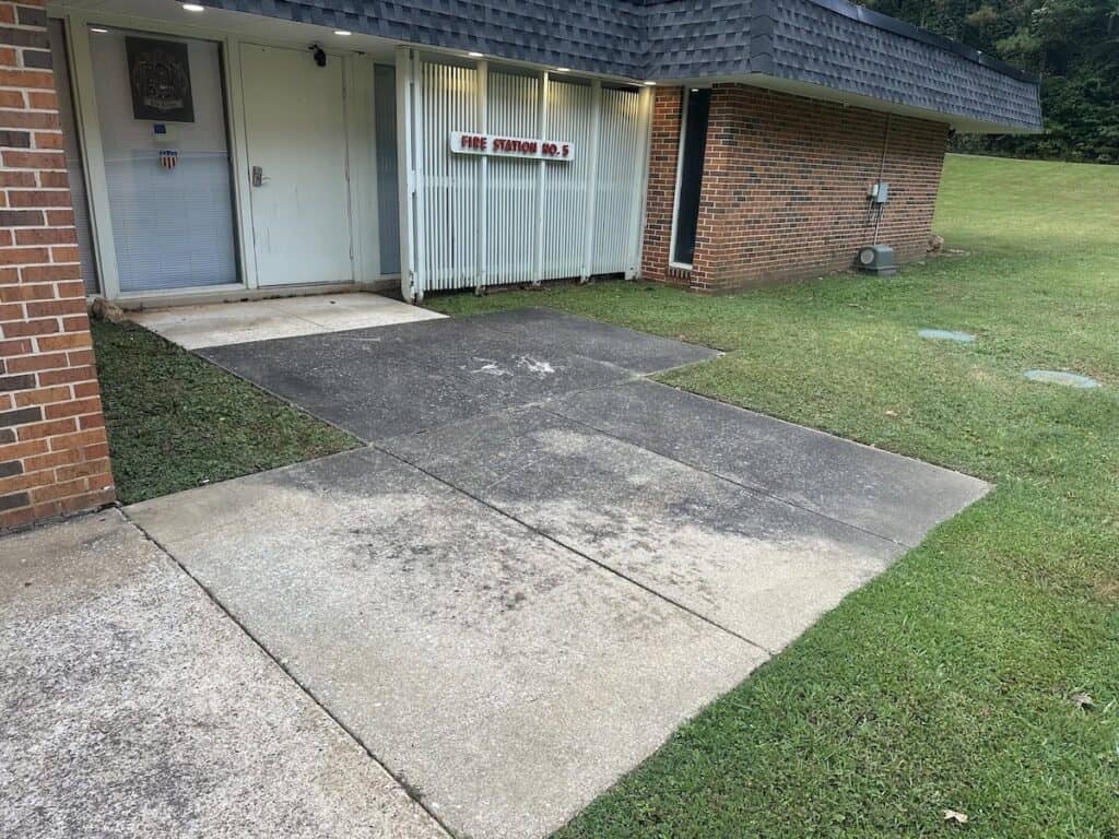 before side walk power washing at fire station